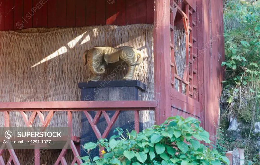 Oriental sculpture on veranda of summerhouse