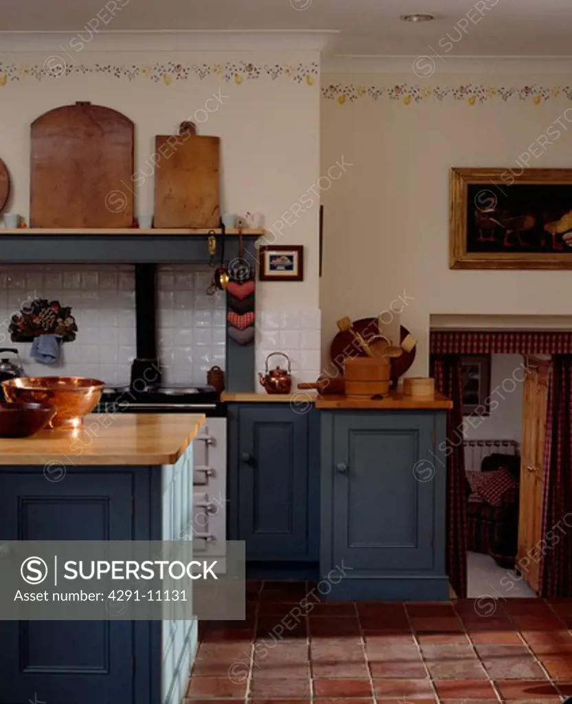 Stencilled border below cornice in blue Shaker-style traditional kitchen