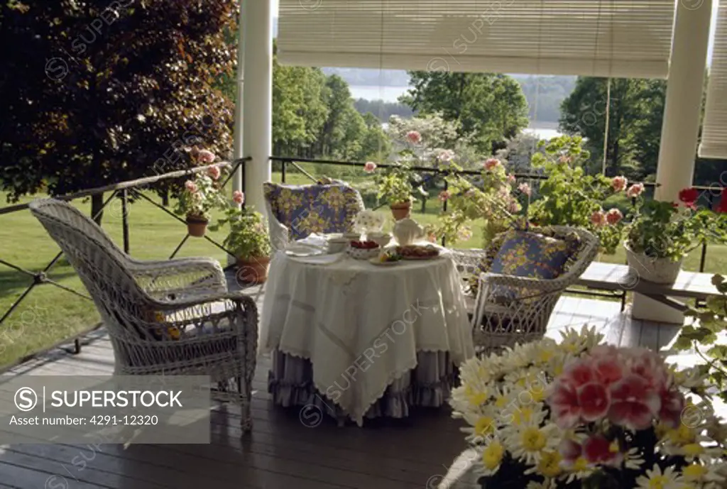 Cloth on table on veranda in country garden in summer
