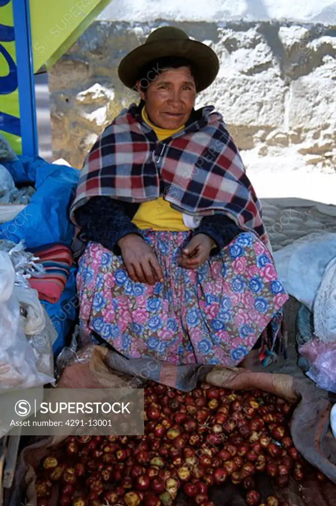 Woman selling fruit on the roadside, Pisac Market, Pisac, near Cusco, Peru
