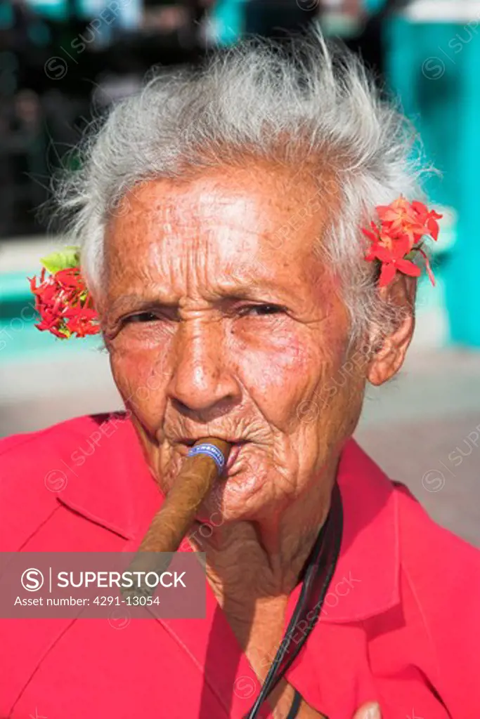 Old lady with a cigar in her mouth, Parque Cespedes, Santiago de Cuba, Cuba