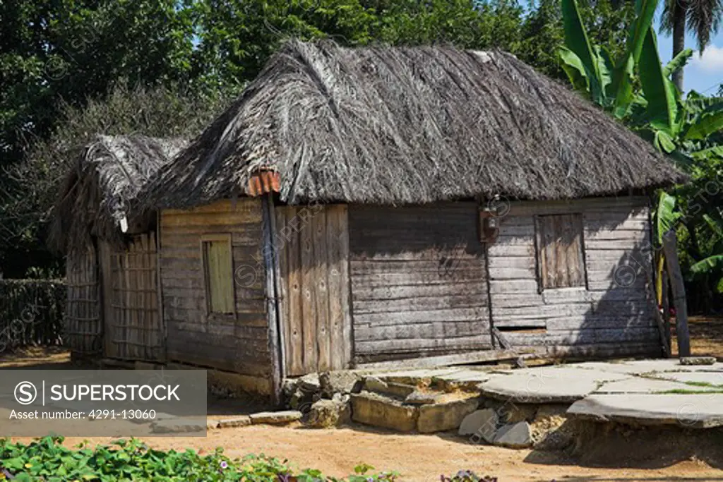 House constructed from wood with a palm tree leaf roof, Camera Village, near Santiago de Cuba, Cuba