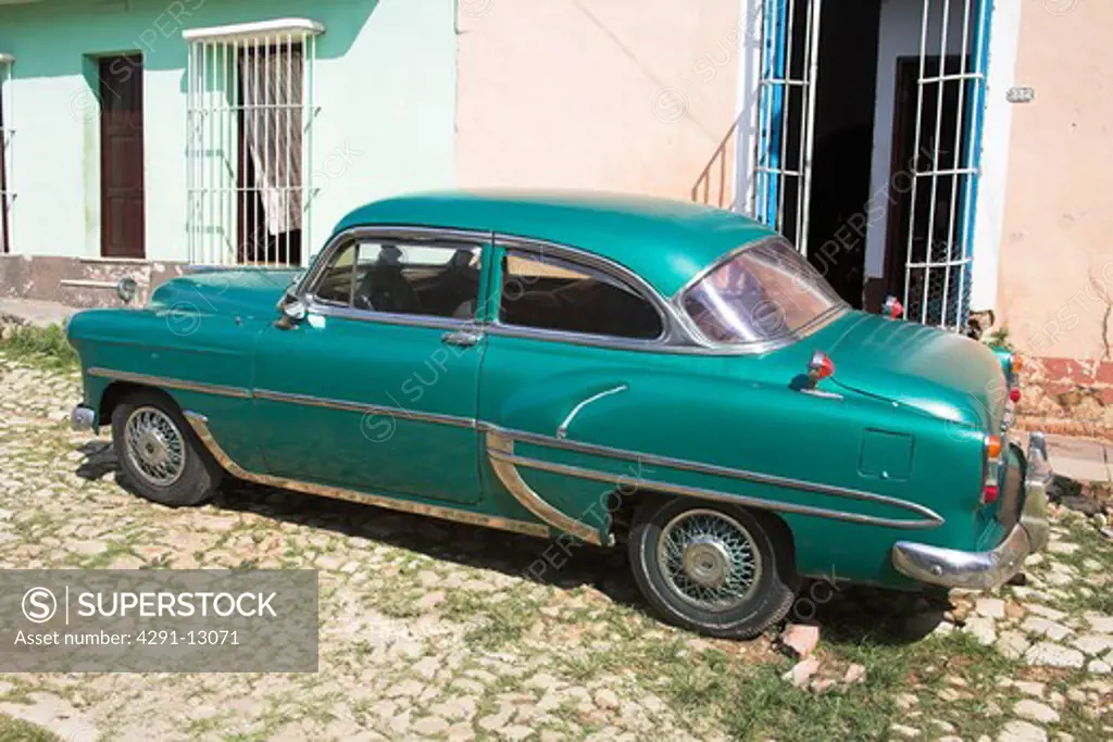 Classic green car parked at the roadside, Trinidad, Sancti Spiritus Province, Cuba