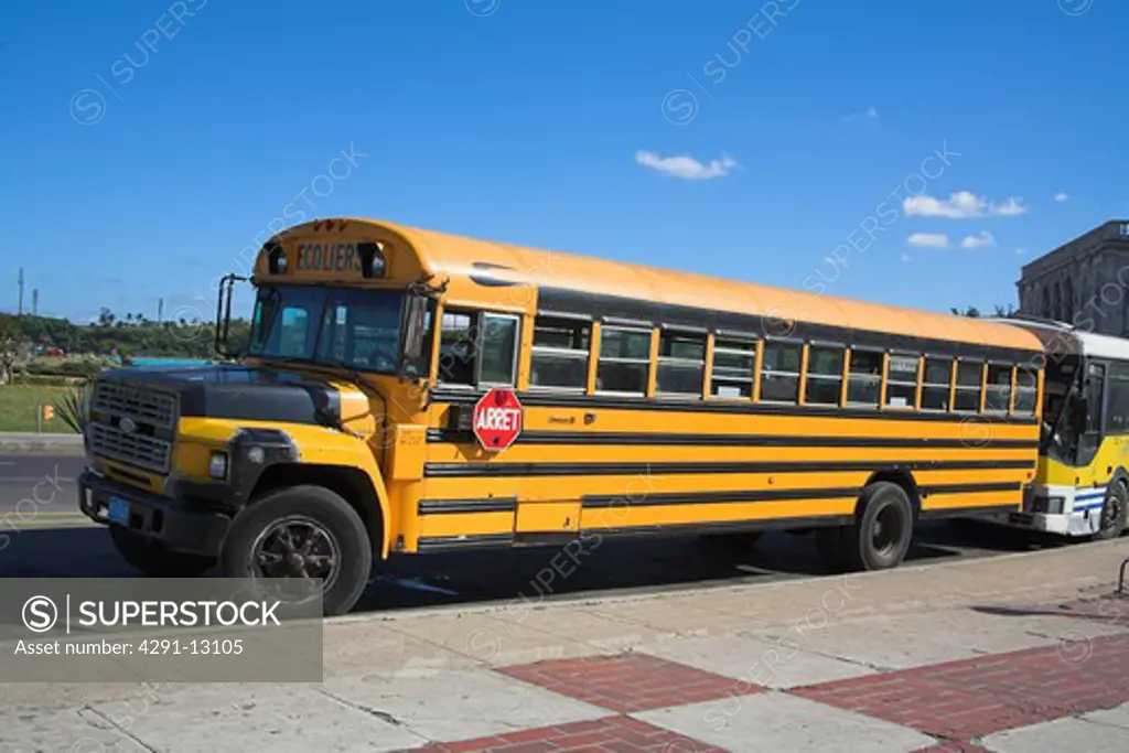 Yellow Ford school bus parked at roadside, Havana, La Habana Vieja, Cuba
