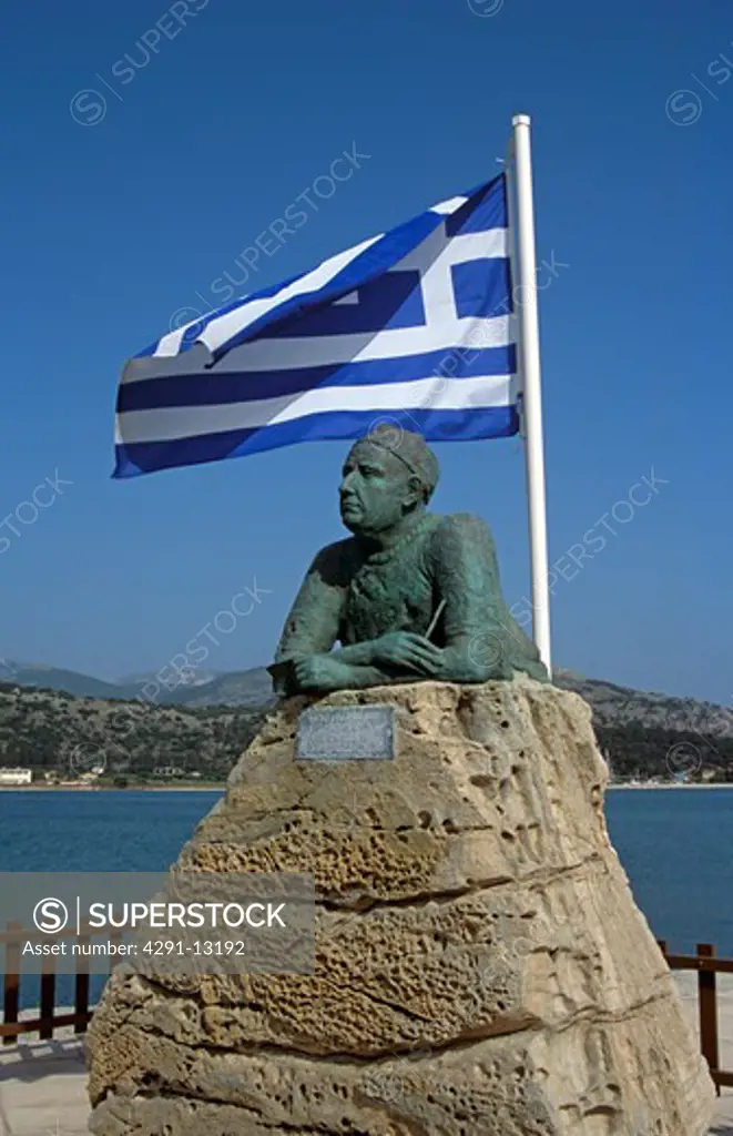 Statue with Greek flag above at entrance to Argostoli Port and Harbour, Argostoli, Kefalonia, Greece