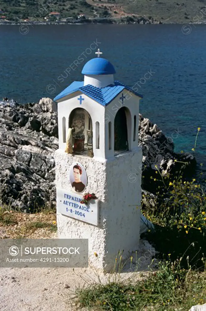 Shrine in memory of young man at roadside, Agia Efimia, Kefalonia, Greece