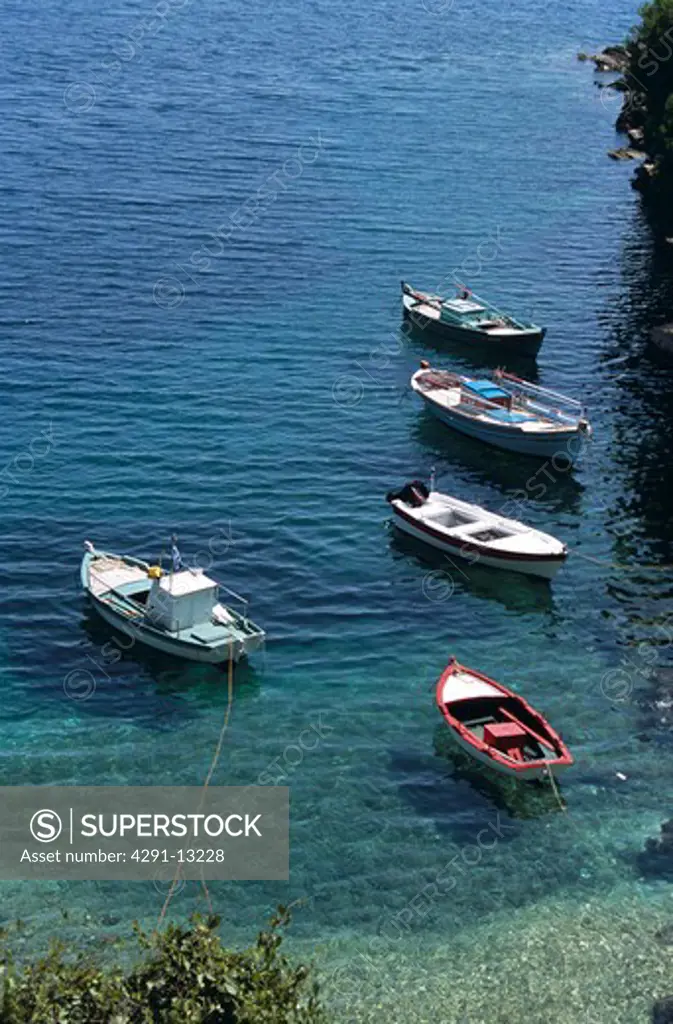 Fishing boats moored in natural harbour, Kioni, Ithaca, Greece
