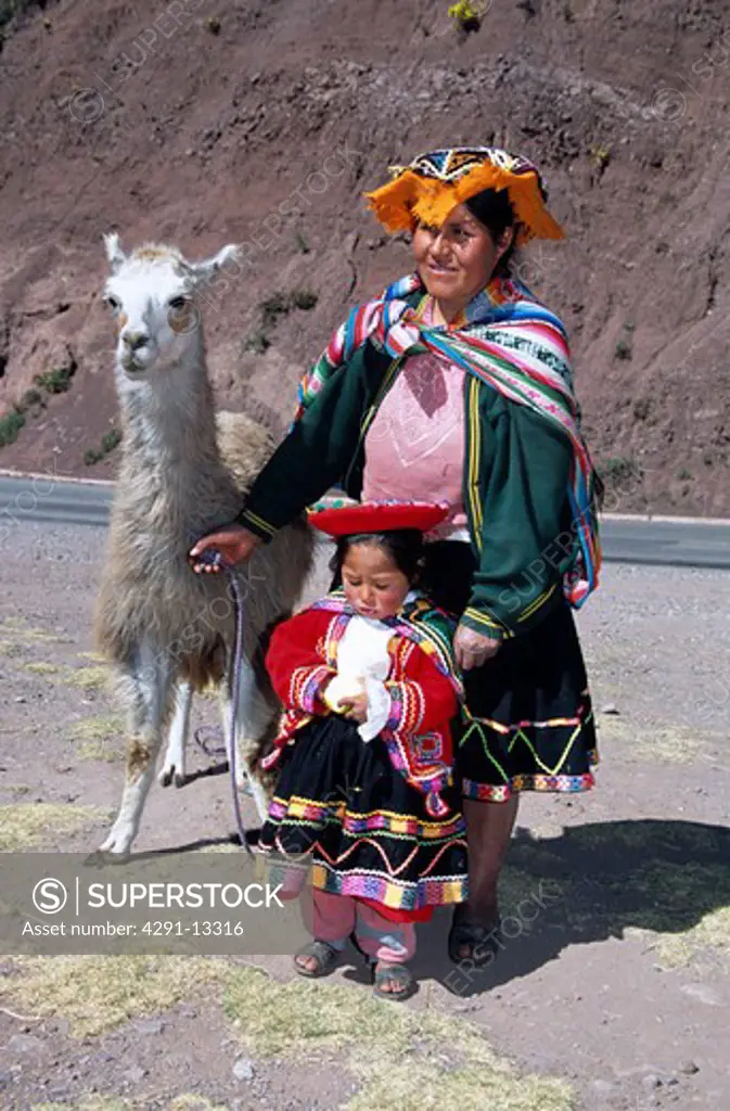 Mother, daughter and llama, near Cusco, Peru