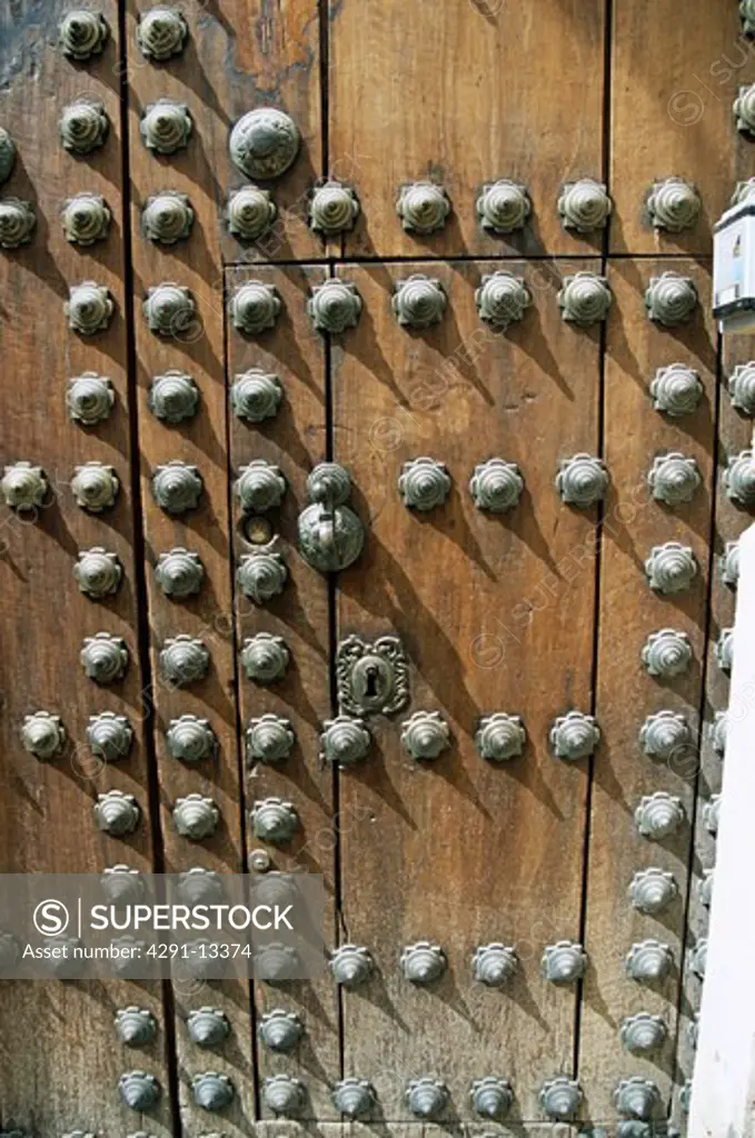 Old wooden studded patterned door, Cordoba, Spain