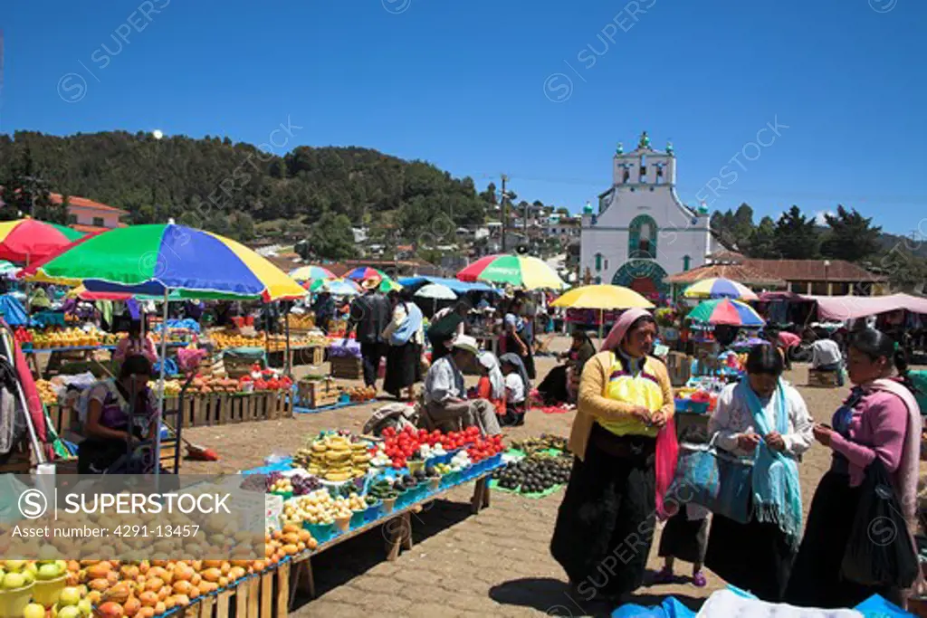 People at market in front of 'Iglesia de San Juan Bautista' in San Juan Chamula, Mexico