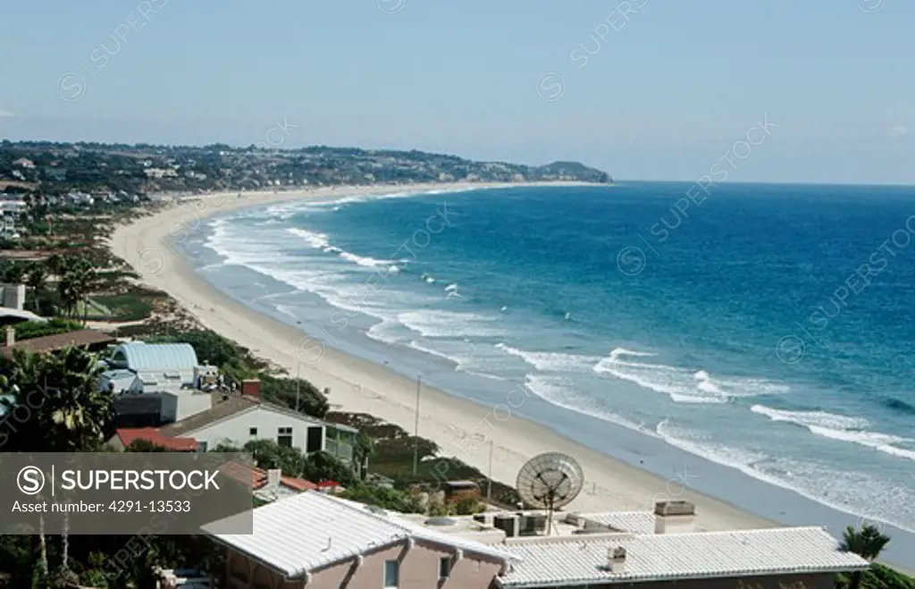 Houses on the beach beside the ocean at Malibu in California