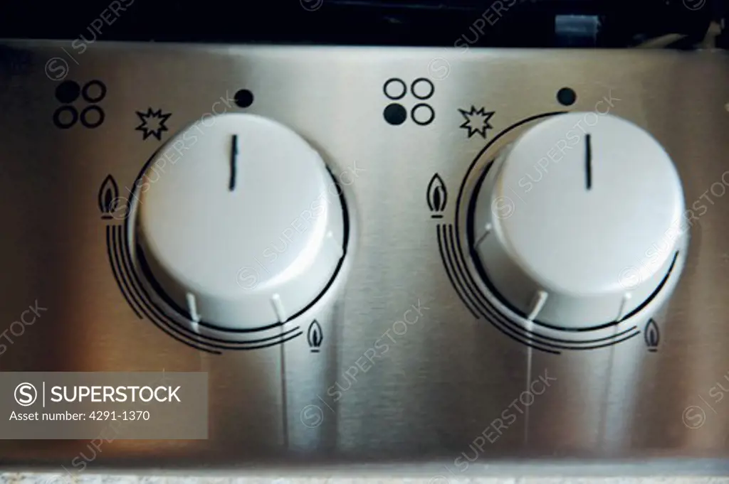 Close-up of control buttons on gas hob