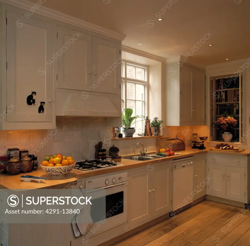 Fitted Kitchen with Wooden Floorboards