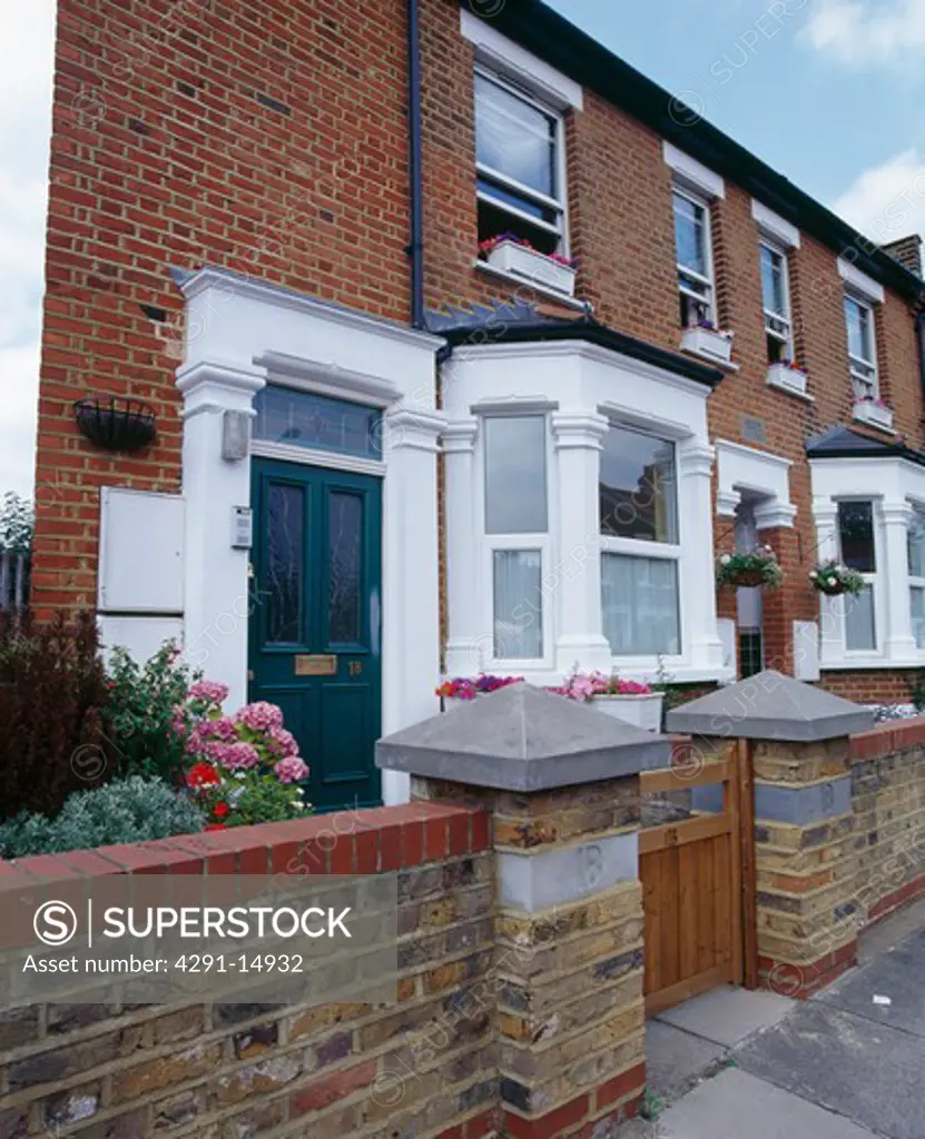 Small terraced Edwardian house with white paintwork