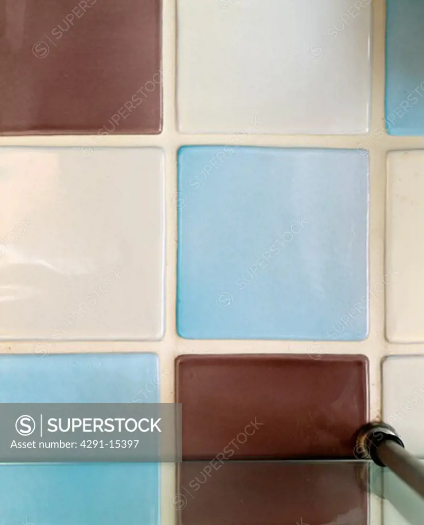 Close-up of blue and cream ceramic wall tiles