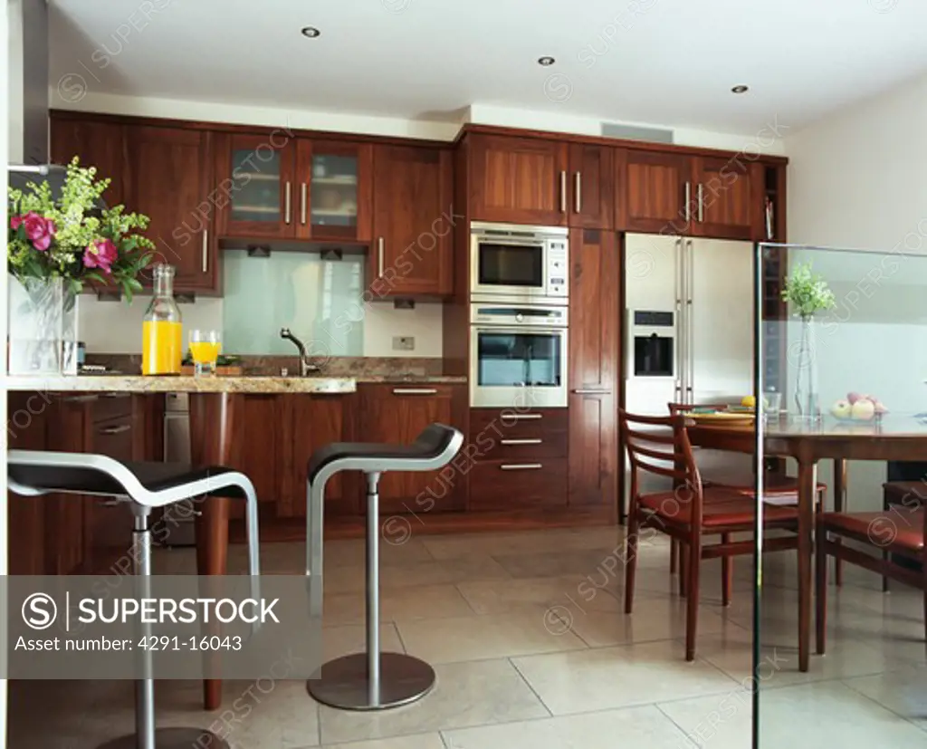 Stainless steel stools in modern kitchen