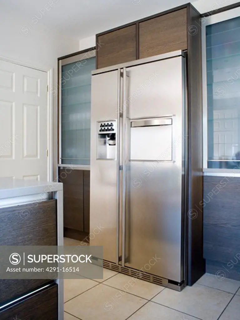 Large American-style stainless-steel fridge-freezer in modern kitchen