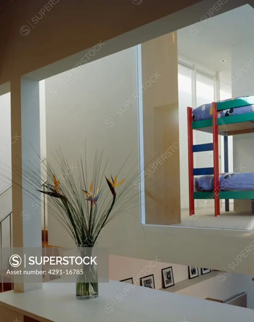 Modern openplan landing with view of bunkbeds in bedroom