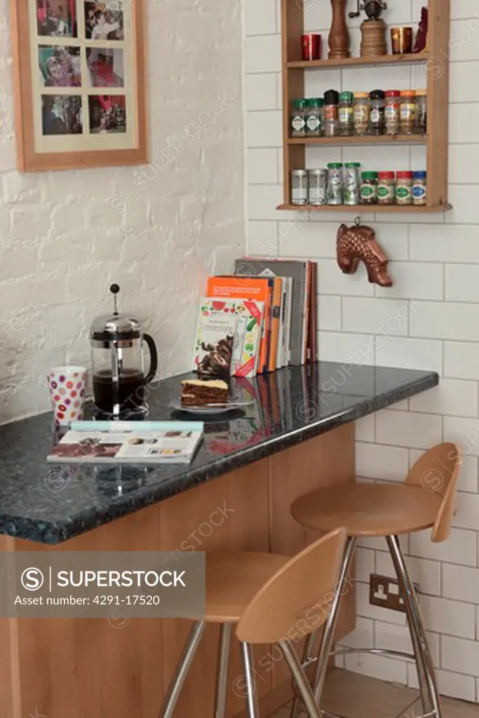 Cafetiere on granite-topped breakfast bar with plywood stools