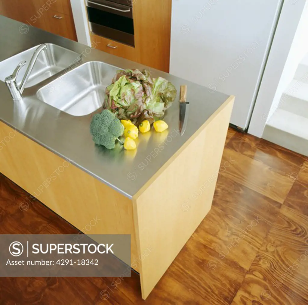 Stainless steel splashback double sink and worktop in modern kitchen