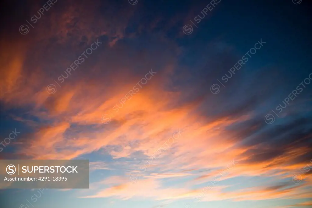Dramatic golden orange clouds at sunset