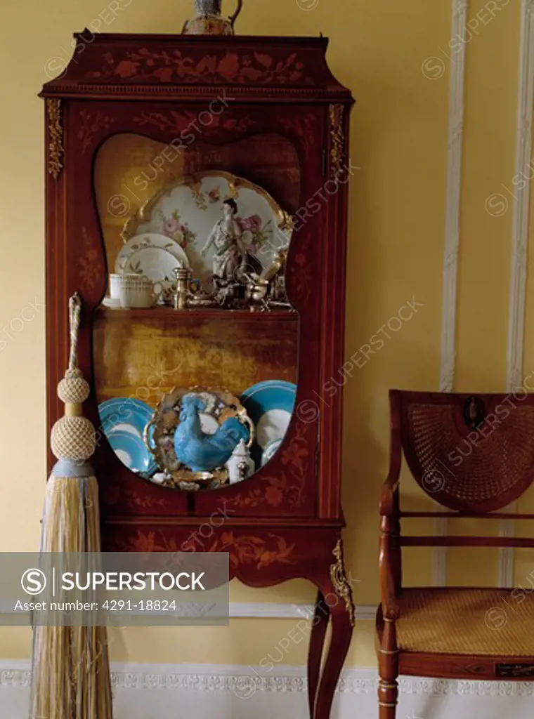 Large tassel on antique cupboard