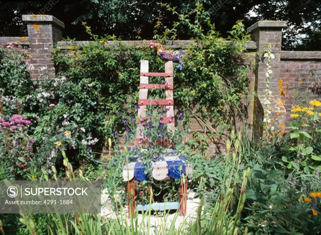 Large hand-made sculptural chair in walled garden