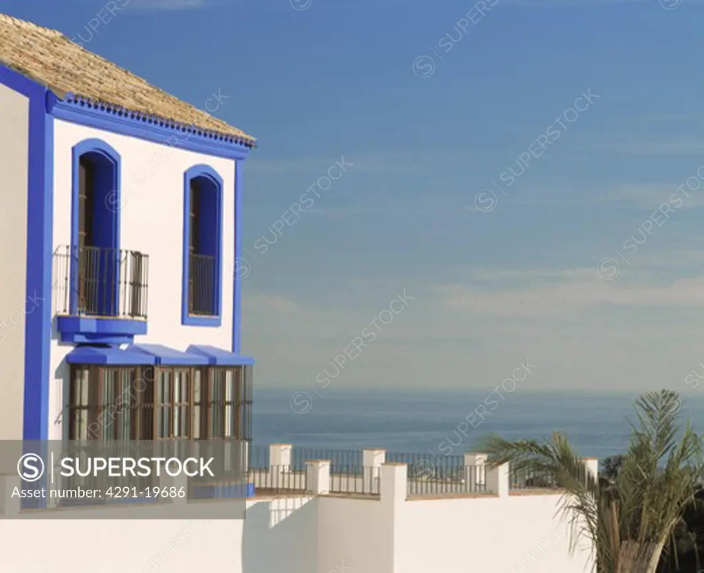 Blue paintwork on white villa with view of the sea in Southern Spain