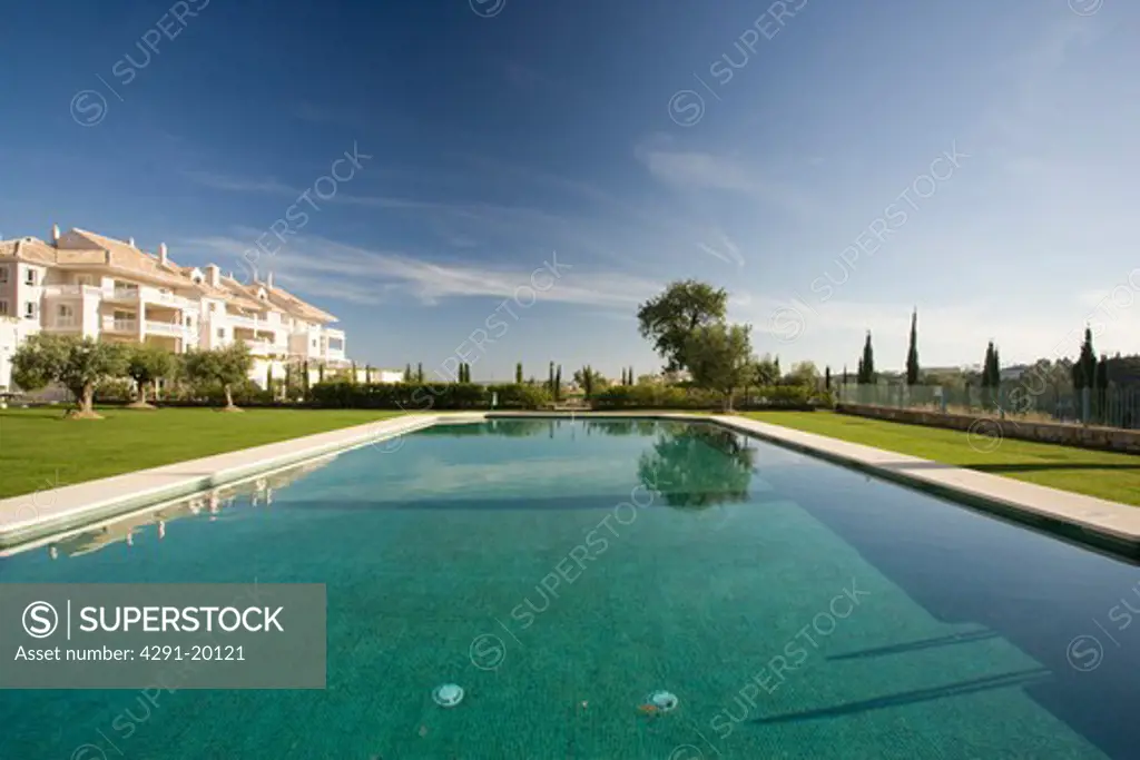 Communal swimming-pool situated in gardens in front of the villas.