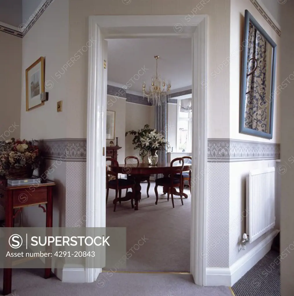 Hall with view of dining room through corner door