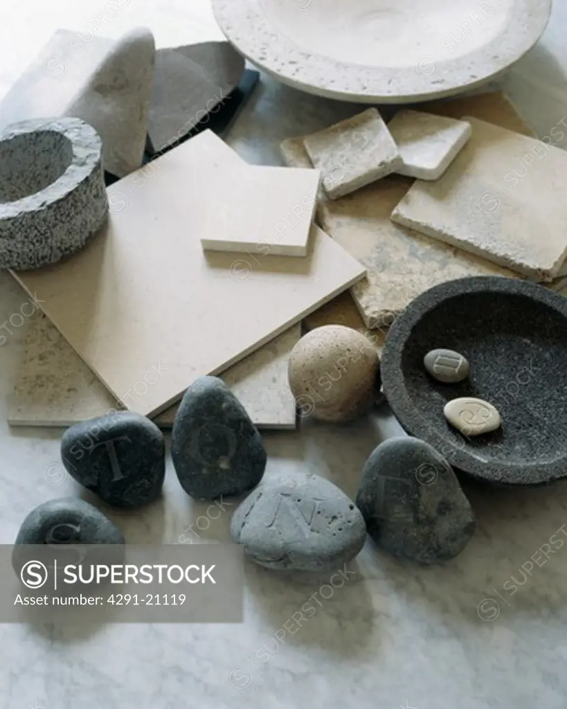 Close-up of pebbles and stone bowls and tiles