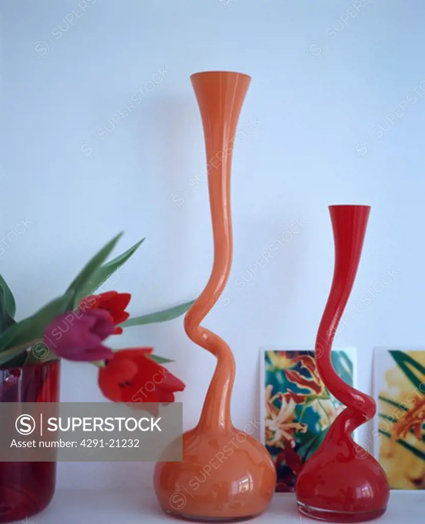 Close-up of modern orange glass vases