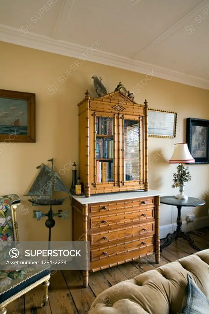 Faux bamboo antique secretaire in traditional living room
