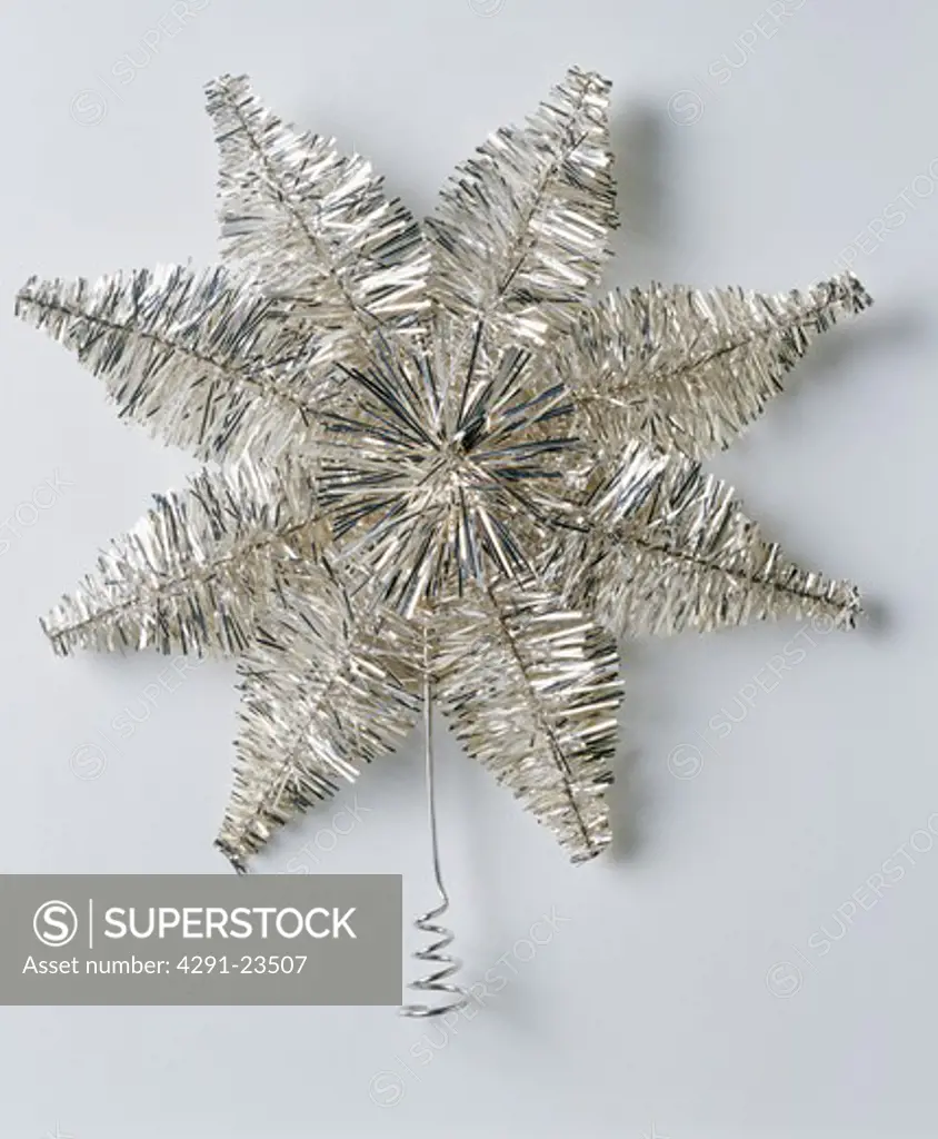Close-up of silver tinsel Christmas star