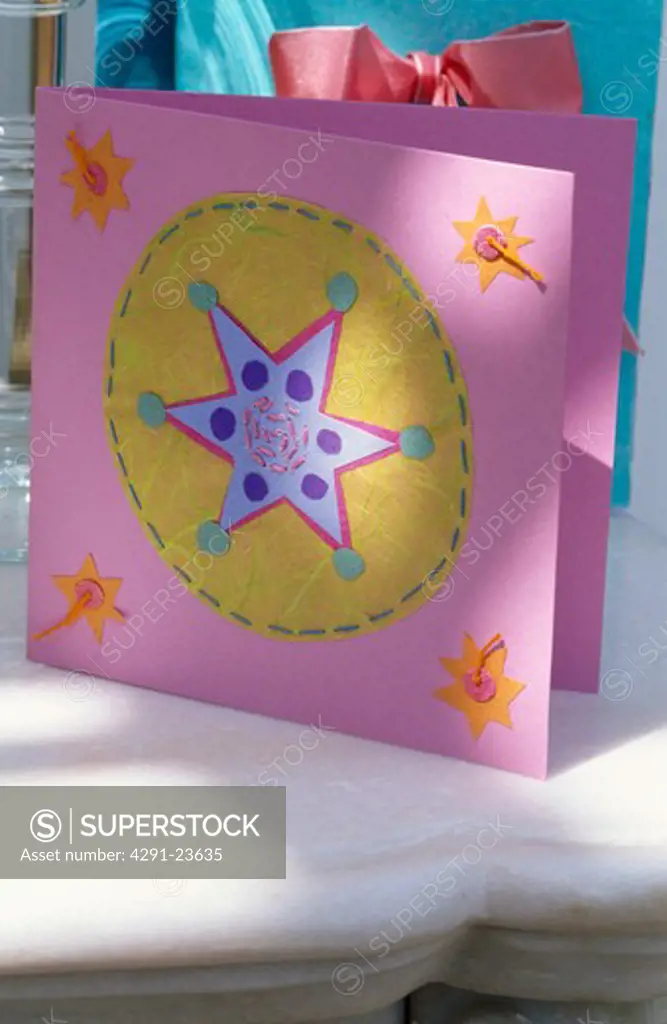 Close-up of pink and yellow appliqued felt and paper birthday card