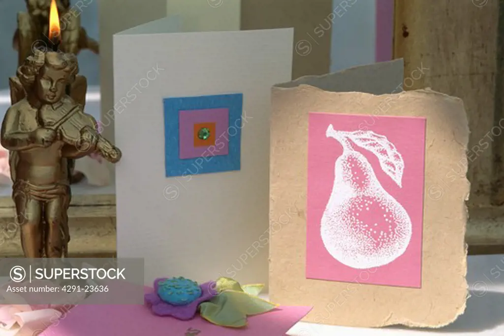 Close-up of home-made stenciled and appliqued birthday cards