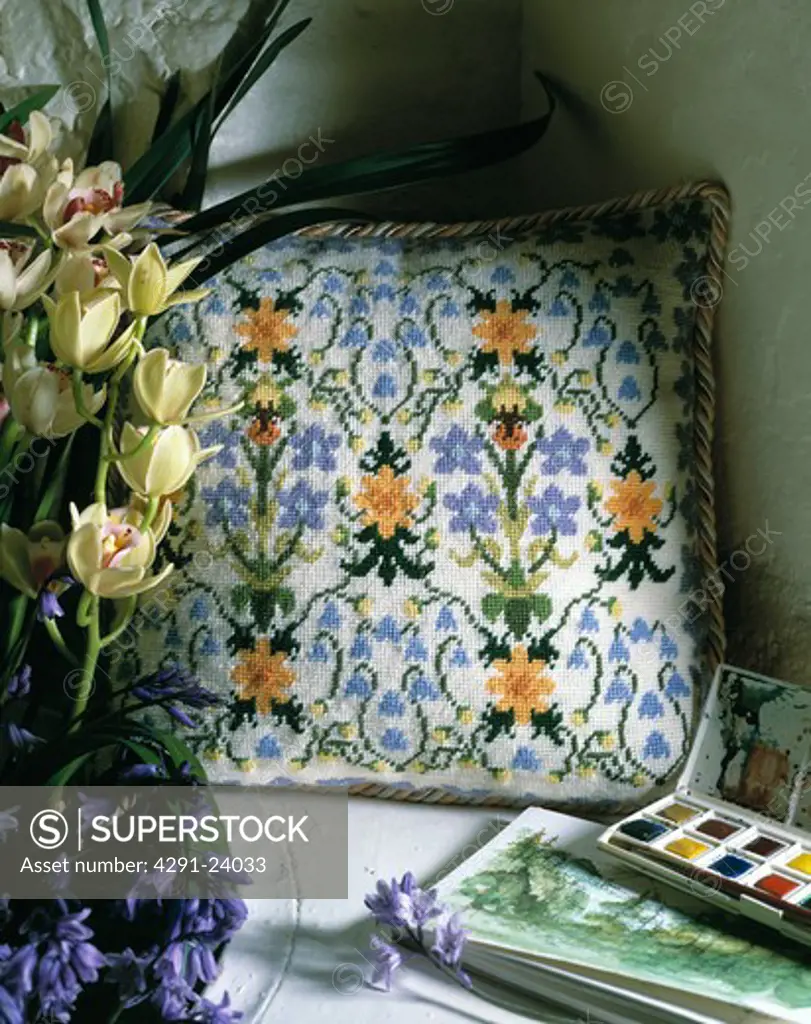 Close-up of floral cross-stitch cushion