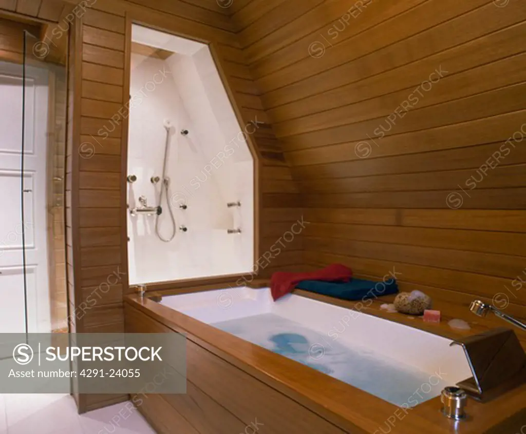 Modern wooden panelling attic bathroom