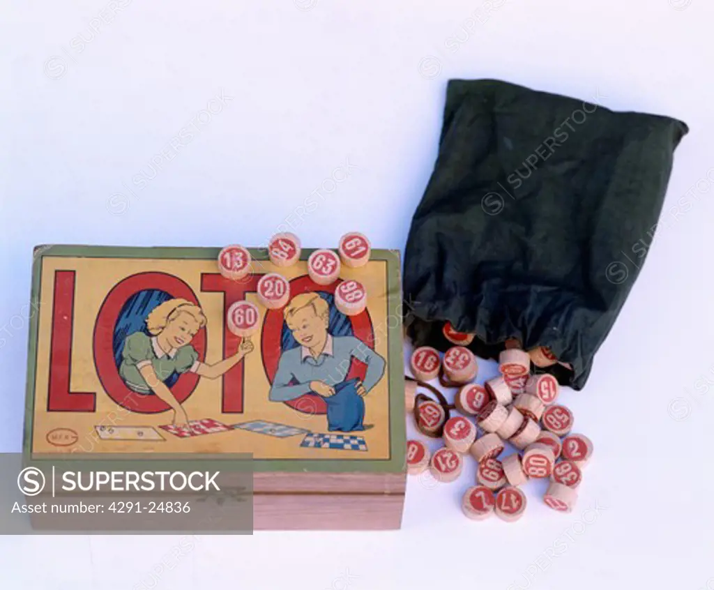 Close-up of thirties box of lotto game with bag of counters