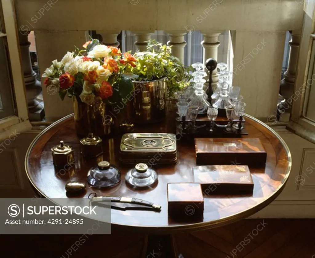 Close-up of collection of antique boxes and inkwells on antique table