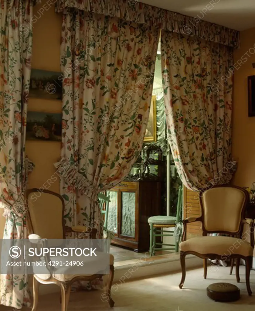 Patterned curtains in traditional living room