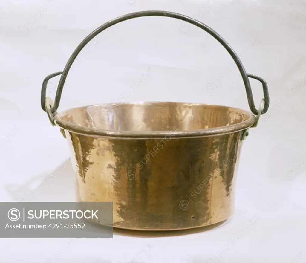 Close-up of brass pan with handle