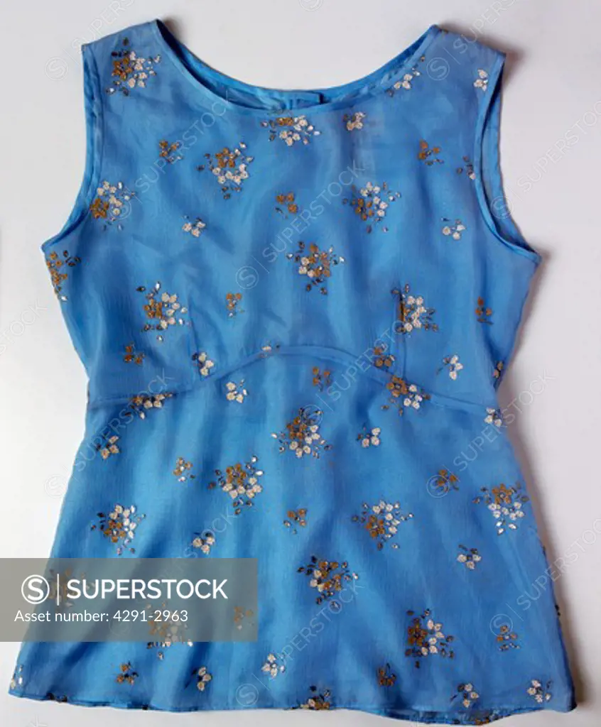Close-up of blue cotton top with floral beading