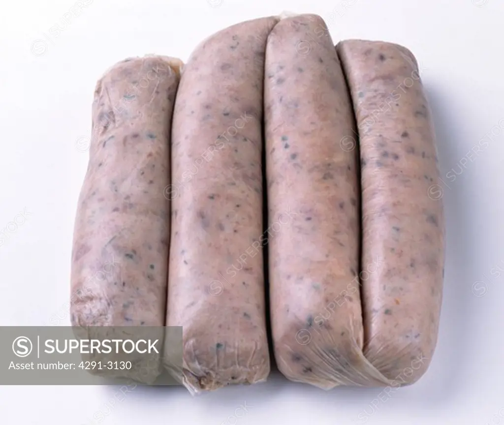 Close-up of four pork sausages