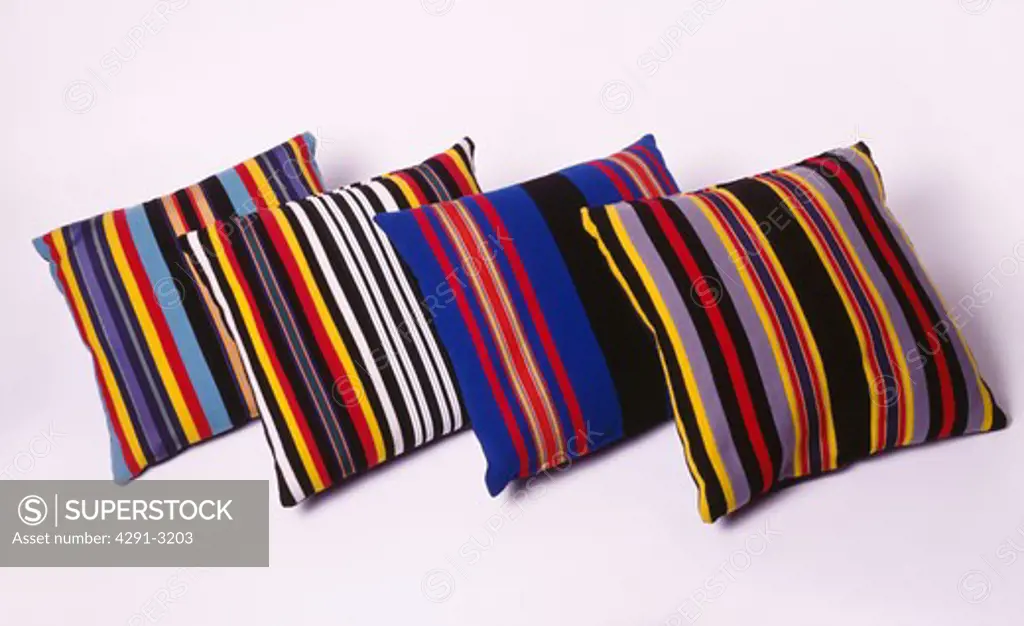 Close-up of multi-coloured striped cushions