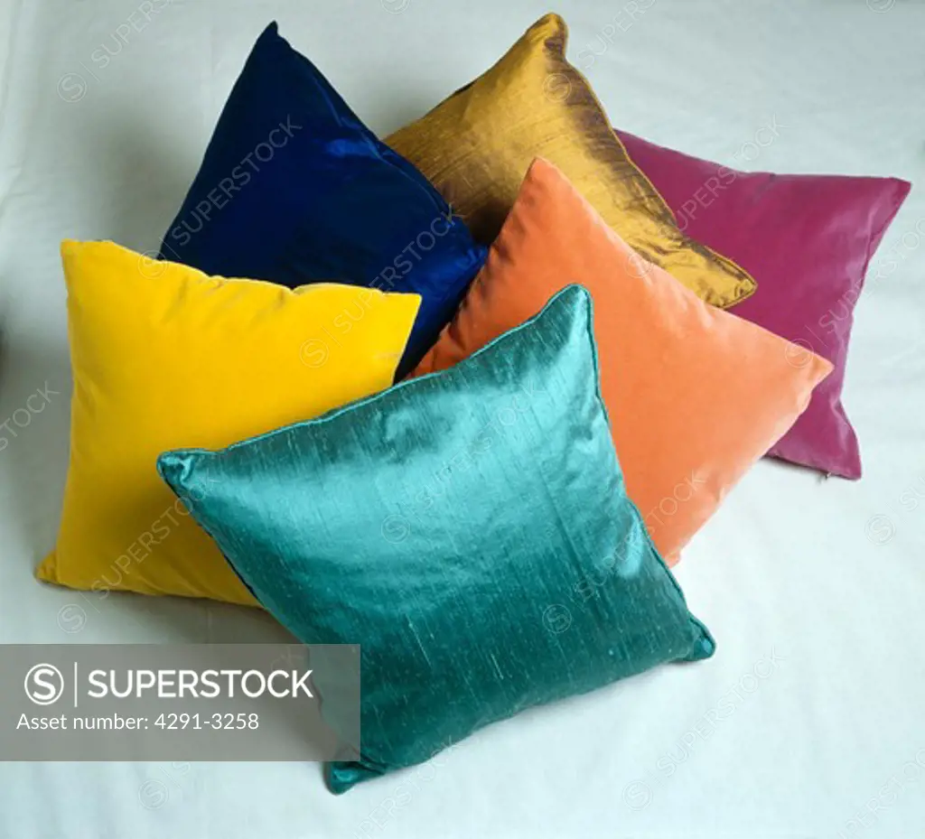 Close-up of colourful velvet and silk cushions