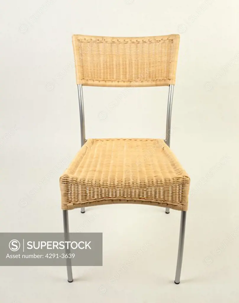 Close-up of wicker and steel dining chair