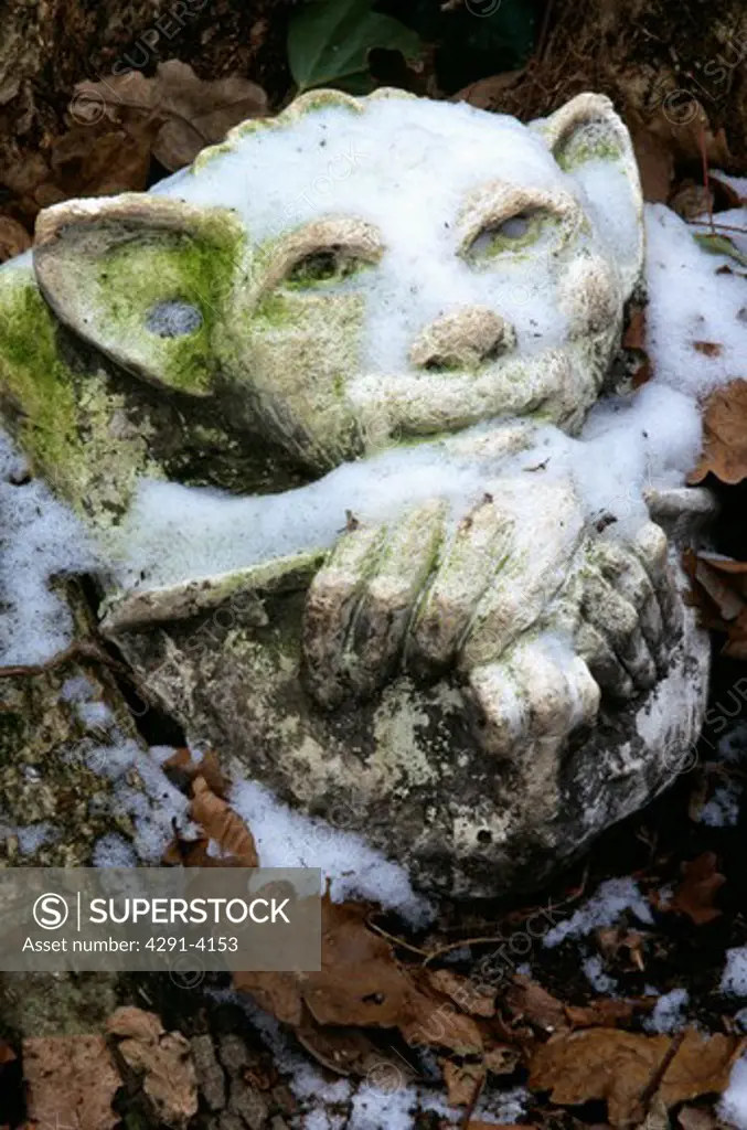 Close-up of sculpture in country garden in winter