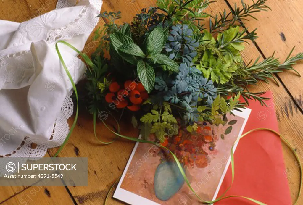 Still-Life of posy of fresh herbs on floral post-card