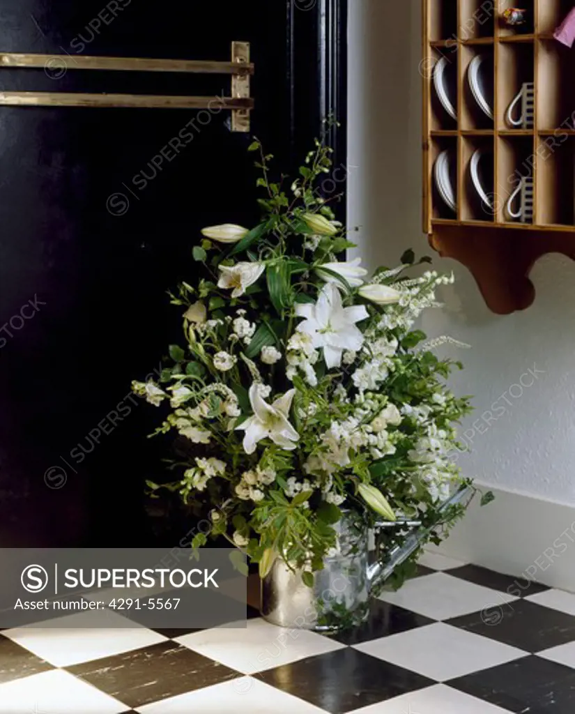 Still-Life of white flowers in watering can